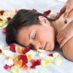 Brunettte getting a back massage in the spa sallon